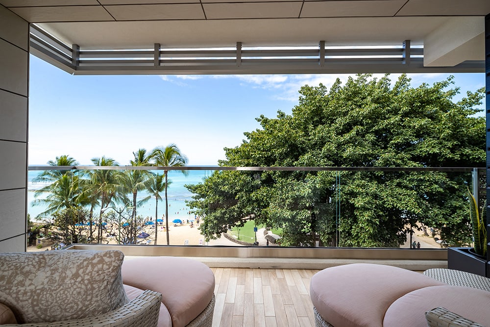 Balcony with loungers and view of Waikiki Beach.
