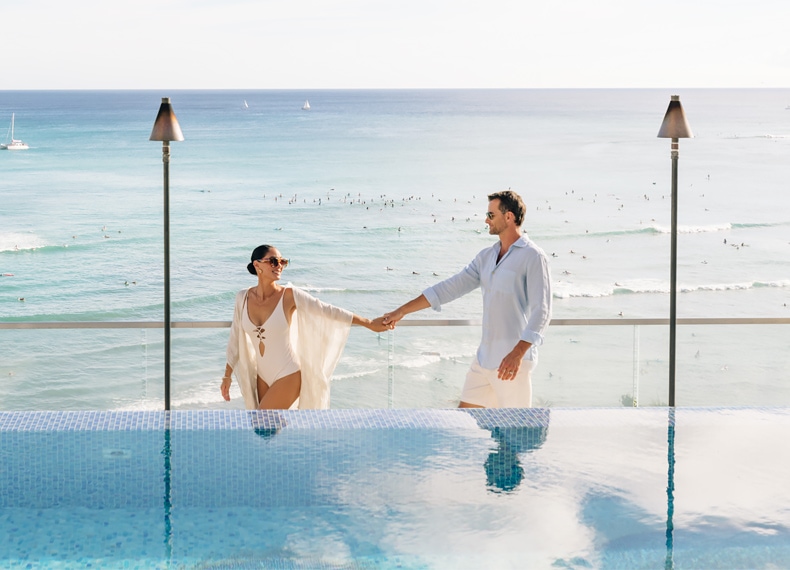 ESPACIO-home-experience-couple-at-pool-790x570
