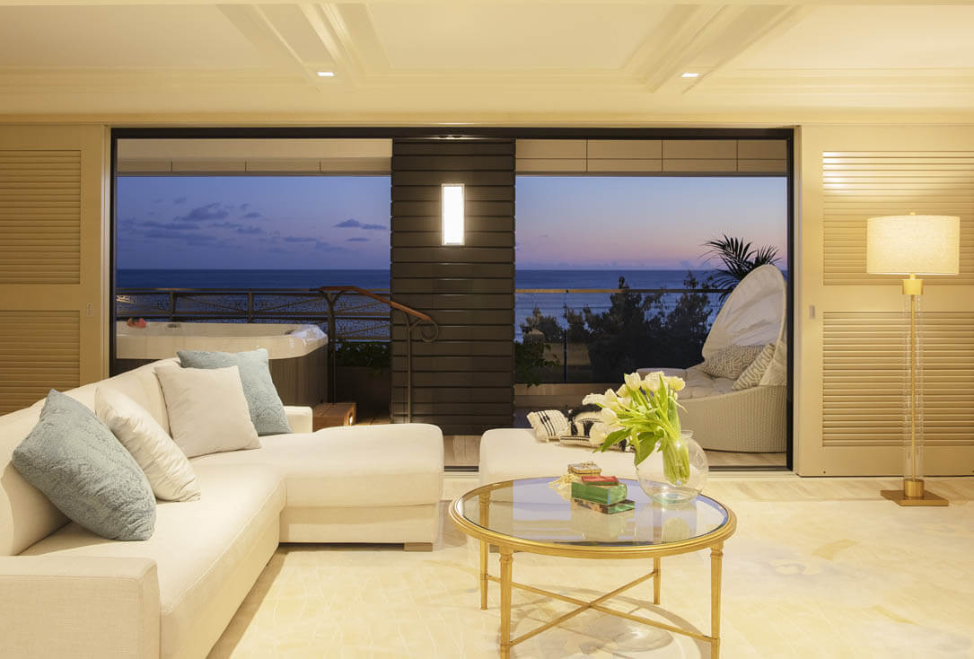 Living room and view of ocean from ESPACIO suite.