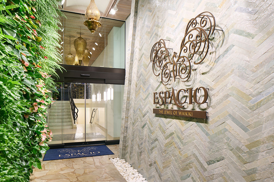 The front entrance to ESPACIO The Jewel of Waikiki features a living wall.