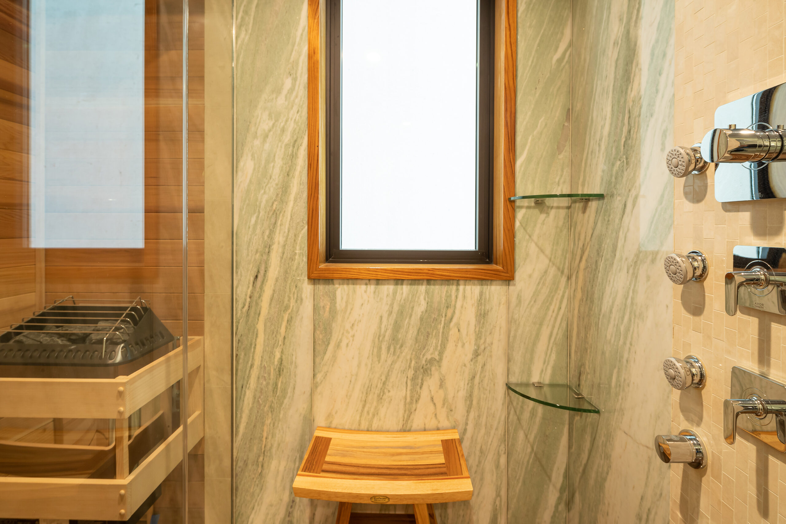 Marble shower with sauna.