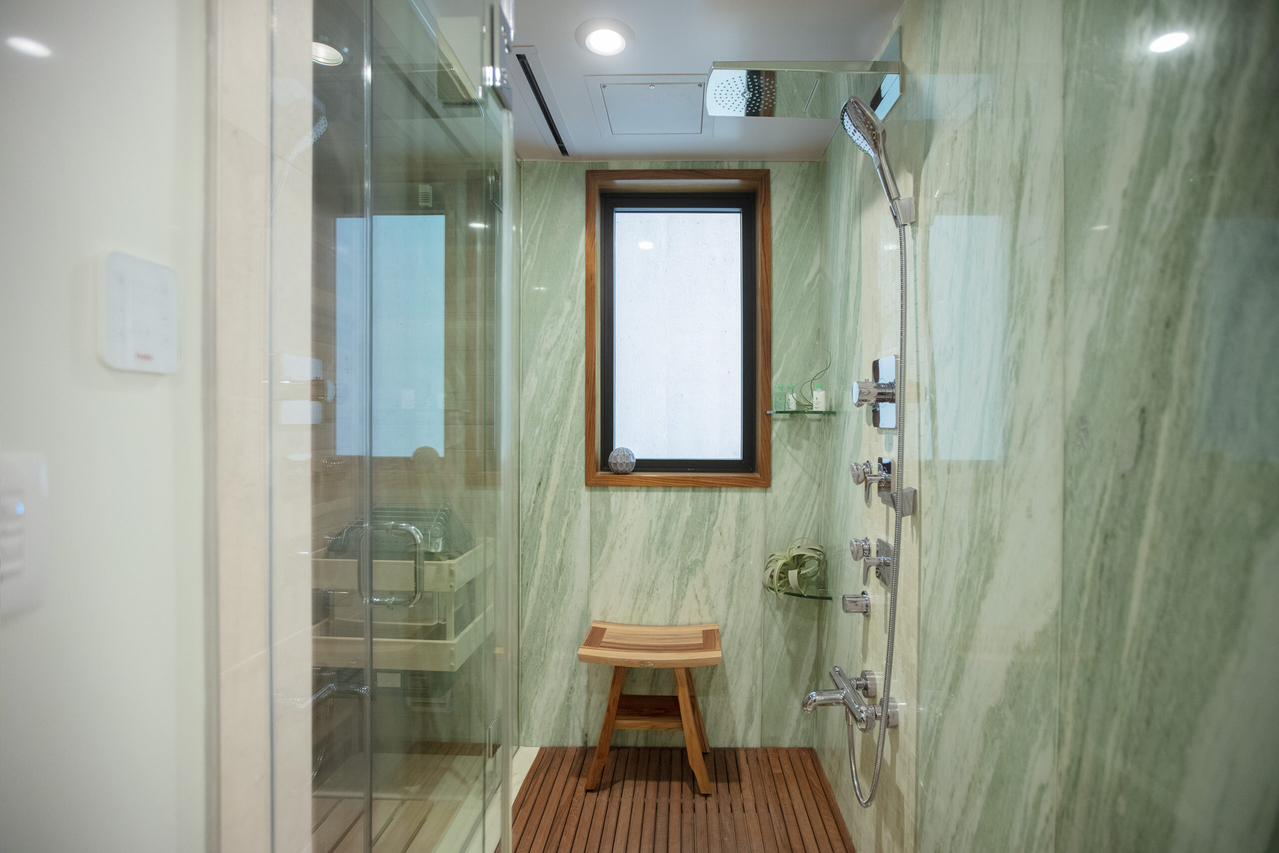 Marble shower with sauna.
