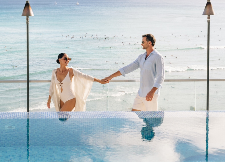 ESPACIO-home-experience-couple-at-pool-790x570