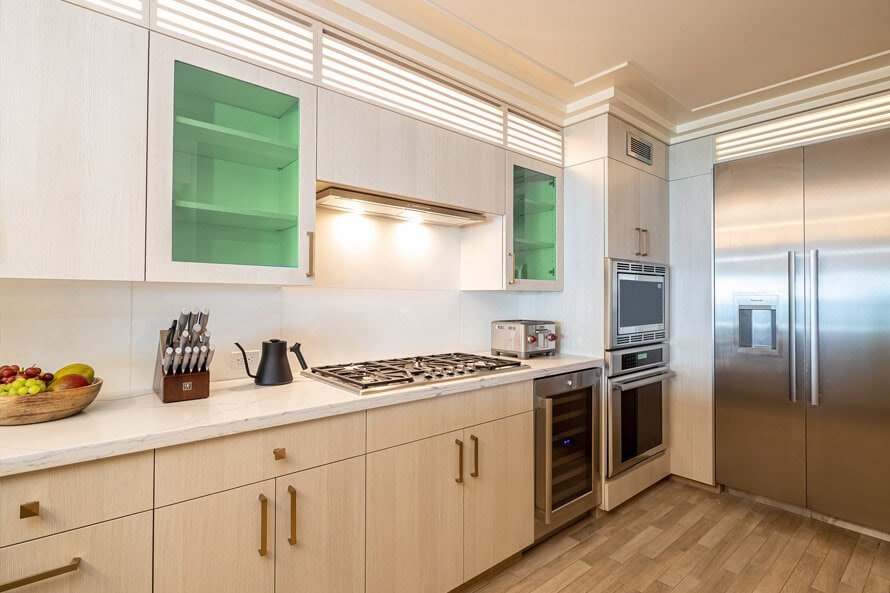 Full kitchen with Thermador and Miele appliances, rice cooker, and wine cellar.