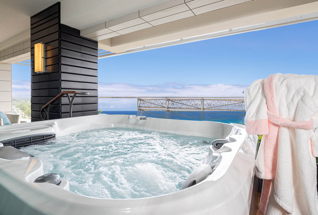 Outdoor Jacuzzi, robe, and ocean views.