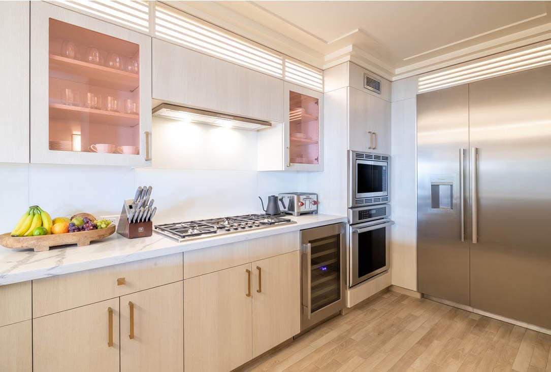 Kitchen with stove, oven, refrigerator.